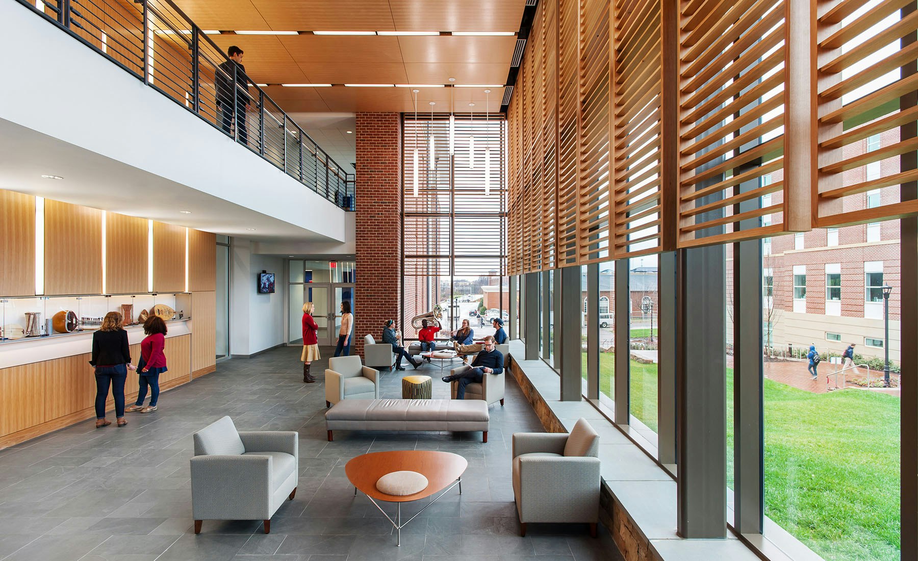 A generous multi-level promenade stitches together the main building’s public spaces and academic programs.